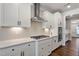 Bright kitchen featuring gas cooktop and white shaker cabinets at 88 Capewood Ct, Garner, NC 27529