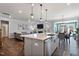 Modern kitchen with large island, stainless steel appliances, and white cabinetry at 88 Capewood Ct, Garner, NC 27529