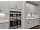 Well-equipped kitchen showcasing double wall ovens and ample counter space at 88 Capewood Ct, Garner, NC 27529