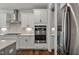 Sleek kitchen with double oven and stainless steel refrigerator at 88 Capewood Ct, Garner, NC 27529