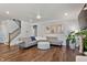 Open living room with hardwood floors and a cozy fireplace at 88 Capewood Ct, Garner, NC 27529