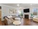 Comfortable living room with L-shaped sofa and a fireplace at 88 Capewood Ct, Garner, NC 27529