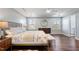 Main bedroom with hardwood floors, and ensuite bathroom access at 88 Capewood Ct, Garner, NC 27529