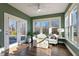 Sunroom with French doors and hardwood floors at 88 Capewood Ct, Garner, NC 27529
