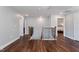 Upstairs hallway with hardwood floors and staircase at 88 Capewood Ct, Garner, NC 27529