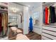 Large walk-in closet with mirrored doors and window at 88 Capewood Ct, Garner, NC 27529