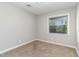 Bright bedroom with neutral walls and carpeted floor at 103 Marion Dr, Erwin, NC 28339