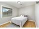 Small bedroom with a single bed, wood floors, and a window with blinds at 103 Marion Dr, Erwin, NC 28339