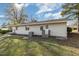 Another view of the home's rear showcasing the patio at 103 Marion Dr, Erwin, NC 28339