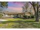 Ranch home with a landscaped lawn and large trees at 103 Marion Dr, Erwin, NC 28339