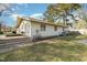 Side view of house with brick steps and patio area at 103 Marion Dr, Erwin, NC 28339