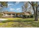 Ranch style home with mature landscaping and a spacious yard at 103 Marion Dr, Erwin, NC 28339