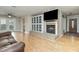 Living room with fireplace, built-in shelving, and hardwood floors at 103 Marion Dr, Erwin, NC 28339