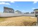 Backyard view of home with white fence and landscaping at 1039 Brockton Dr, Mebane, NC 27302