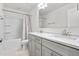 Modern bathroom with double vanity and shower/tub combo at 1039 Brockton Dr, Mebane, NC 27302
