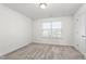 Bright bedroom with window, closet, and neutral carpet at 1039 Brockton Dr, Mebane, NC 27302