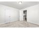 Spacious bedroom with two doors and light carpet at 1039 Brockton Dr, Mebane, NC 27302