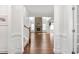 Bright entryway with hardwood floors and a view of a living room with a fireplace at 1039 Brockton Dr, Mebane, NC 27302