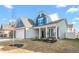 Two-story light gray house with dark blue shutters and a two-car garage at 1039 Brockton Dr, Mebane, NC 27302
