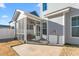House exterior showcasing screened porch and backyard at 1039 Brockton Dr, Mebane, NC 27302