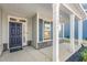 Front porch with white columns and a dark blue front door at 1039 Brockton Dr, Mebane, NC 27302
