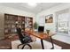 Bright home office features built-in shelves and a large desk at 1039 Brockton Dr, Mebane, NC 27302