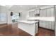 Modern kitchen with gray cabinets, quartz countertops and island at 1039 Brockton Dr, Mebane, NC 27302