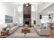 Living room with fireplace, large windows and comfortable seating at 1039 Brockton Dr, Mebane, NC 27302