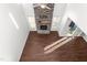 Living room with hardwood floors and a stone fireplace at 1039 Brockton Dr, Mebane, NC 27302