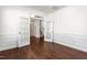 Home office with hardwood floors, wainscoting, and double glass doors at 1039 Brockton Dr, Mebane, NC 27302