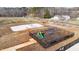 Community playground with swings and sandpit at 1039 Brockton Dr, Mebane, NC 27302