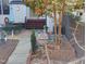 Enchanting backyard patio area features outdoor dining set and landscaped garden at 121 Lumina Pl, Holly Springs, NC 27540