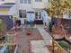 Landscaped backyard featuring patio area, garden beds, and decorative outdoor elements at 121 Lumina Pl, Holly Springs, NC 27540