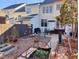 Well maintained backyard featuring patio area, garden beds, and landscaping at 121 Lumina Pl, Holly Springs, NC 27540