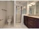 Bathroom featuring tile floors, glass shower, and granite vanity at 121 Lumina Pl, Holly Springs, NC 27540