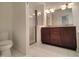 Bathroom featuring a shower, toilet, tile flooring and granite vanity at 121 Lumina Pl, Holly Springs, NC 27540