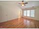 Bedroom with vaulted ceiling, multiple windows, and ceiling fan at 121 Lumina Pl, Holly Springs, NC 27540