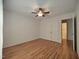 Bedroom with an open closet and hardwood floors at 121 Lumina Pl, Holly Springs, NC 27540