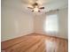 Bedroom featuring a ceiling fan, natural light, and gleaming hardwood floors at 121 Lumina Pl, Holly Springs, NC 27540