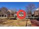 Picturesque community with a water fountain, surrounded by neatly aligned townhomes, creating a serene and inviting atmosphere at 121 Lumina Pl, Holly Springs, NC 27540