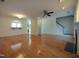 Open floor plan showing hardwood floors, fireplace, staircase and a view into the kitchen at 121 Lumina Pl, Holly Springs, NC 27540