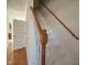 Staircase with white risers and wooden handrail at 121 Lumina Pl, Holly Springs, NC 27540