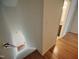 View down the staircase to hardwood floor at 121 Lumina Pl, Holly Springs, NC 27540