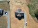 Aerial view of the home with spacious lot and gravel driveways at 1820 Johnson Rd, Burlington, NC 27217