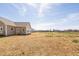 Expansive backyard featuring a well-maintained lawn and the home's exterior at 1820 Johnson Rd, Burlington, NC 27217