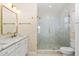 Modern bathroom with double marble vanity, brass hardware and large glass shower at 1820 Johnson Rd, Burlington, NC 27217