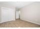 Spacious bedroom featuring a closet with sliding doors and wood flooring at 1820 Johnson Rd, Burlington, NC 27217