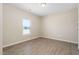 Well-lit bedroom with light wood flooring and a bright window at 1820 Johnson Rd, Burlington, NC 27217