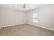 Neutral bedroom with ceiling fan and window at 1820 Johnson Rd, Burlington, NC 27217