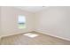 Bright bedroom with ample natural light and sleek wood-look flooring at 1820 Johnson Rd, Burlington, NC 27217